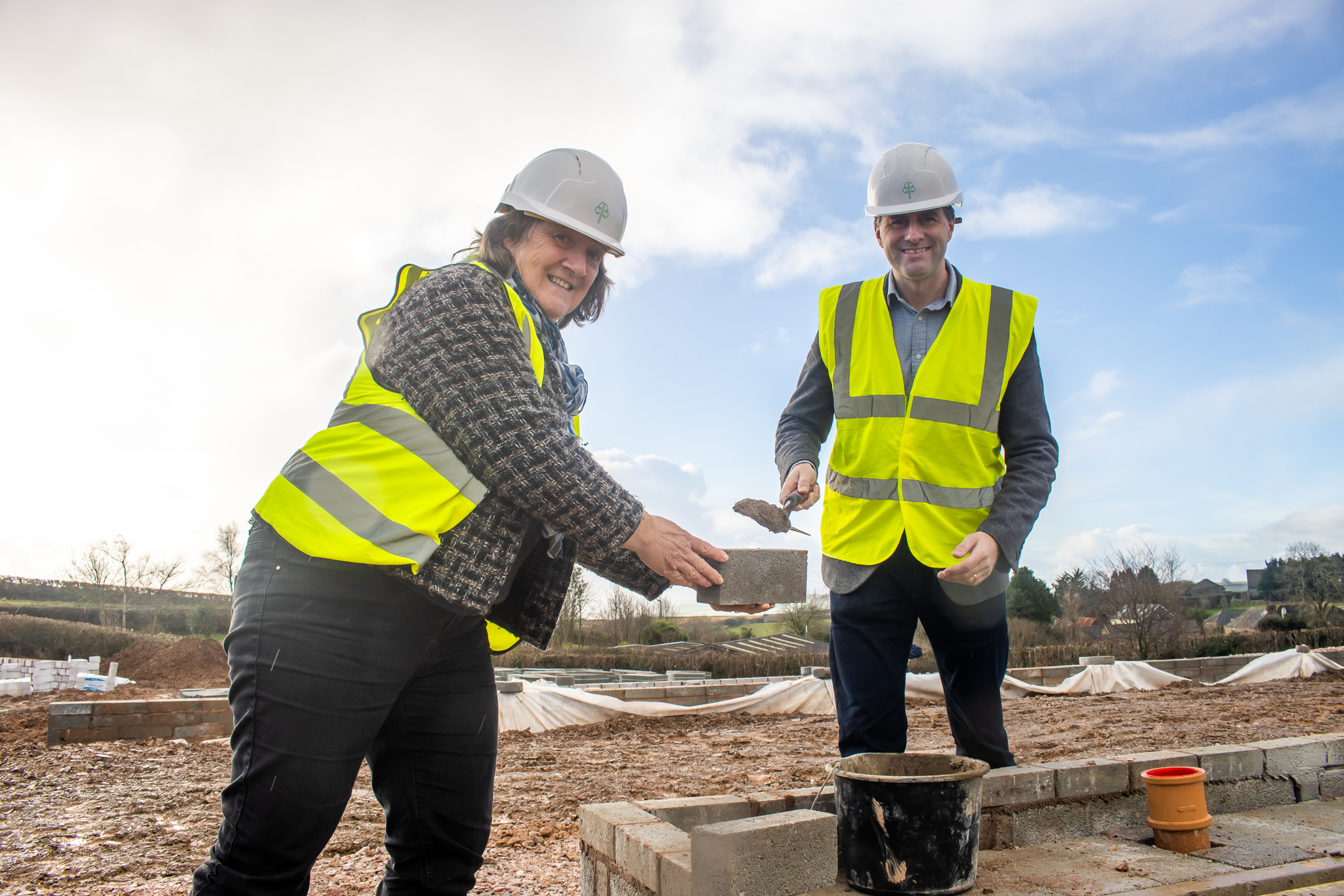 Councillor helps to lay first brick at Baker Estates’ landmark housing development in Dartmouth